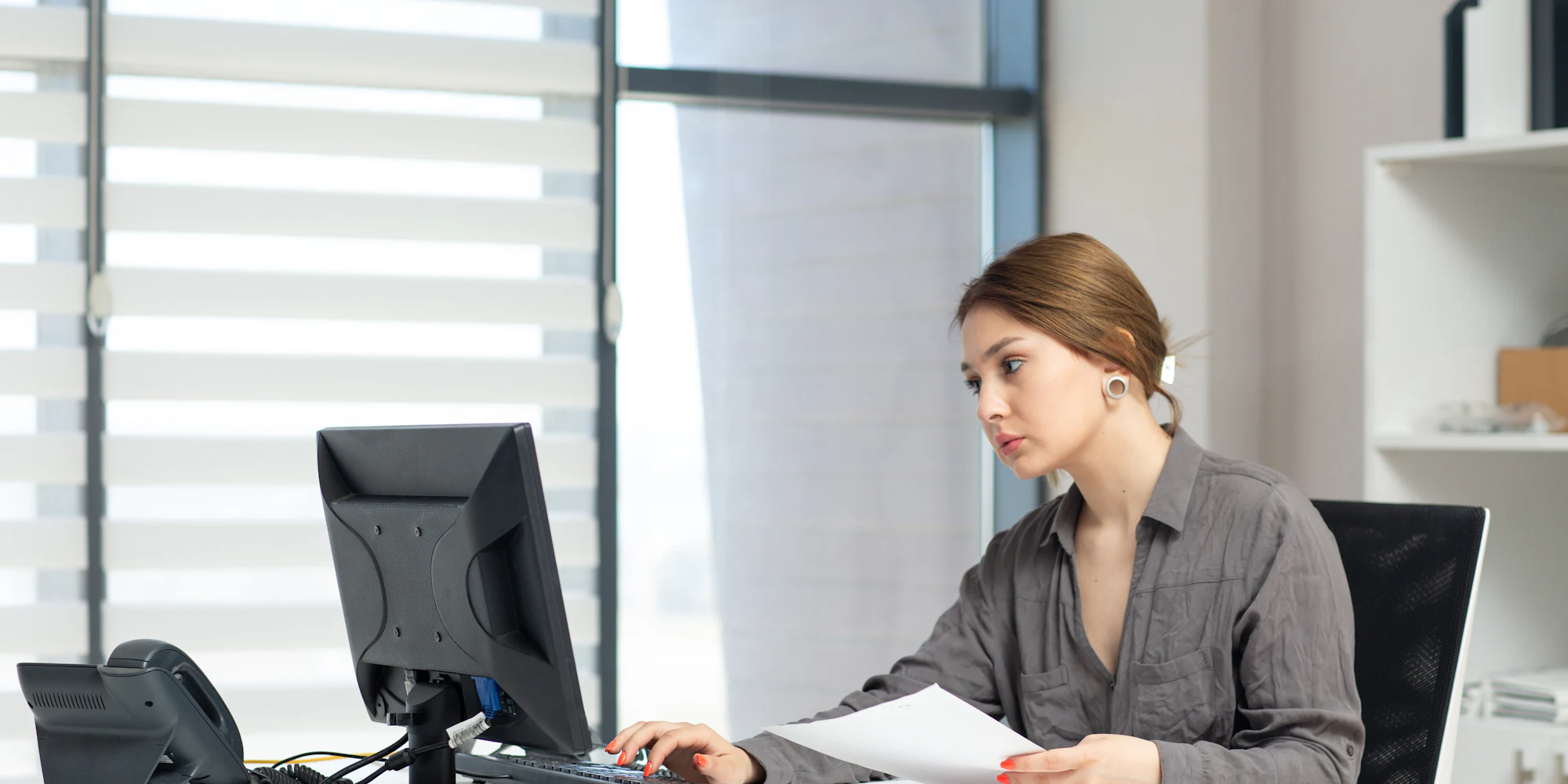 A consultant reviewing a client's workflows and documents during an AI opportunity audit